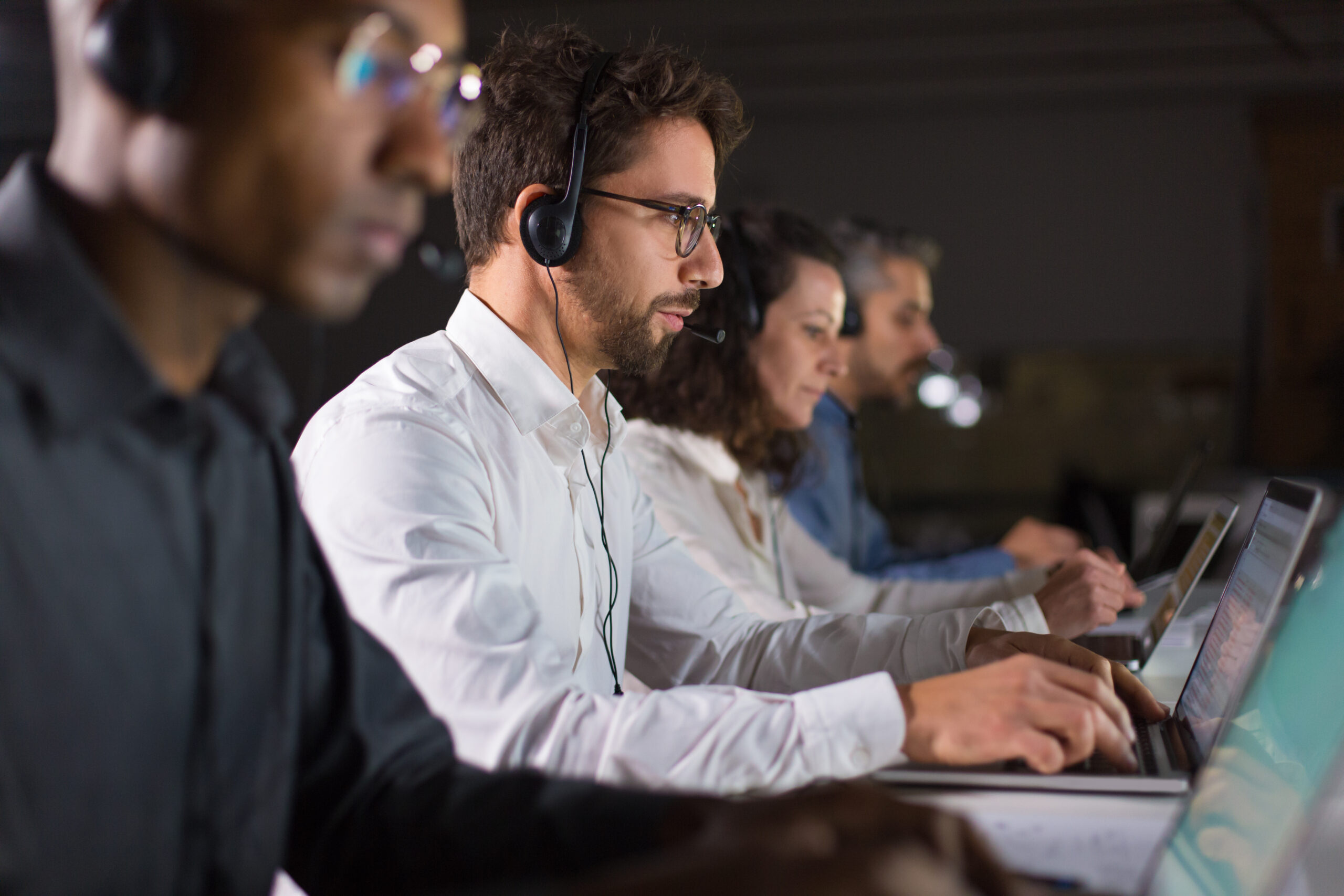 Confident call centre operator speaking with a client