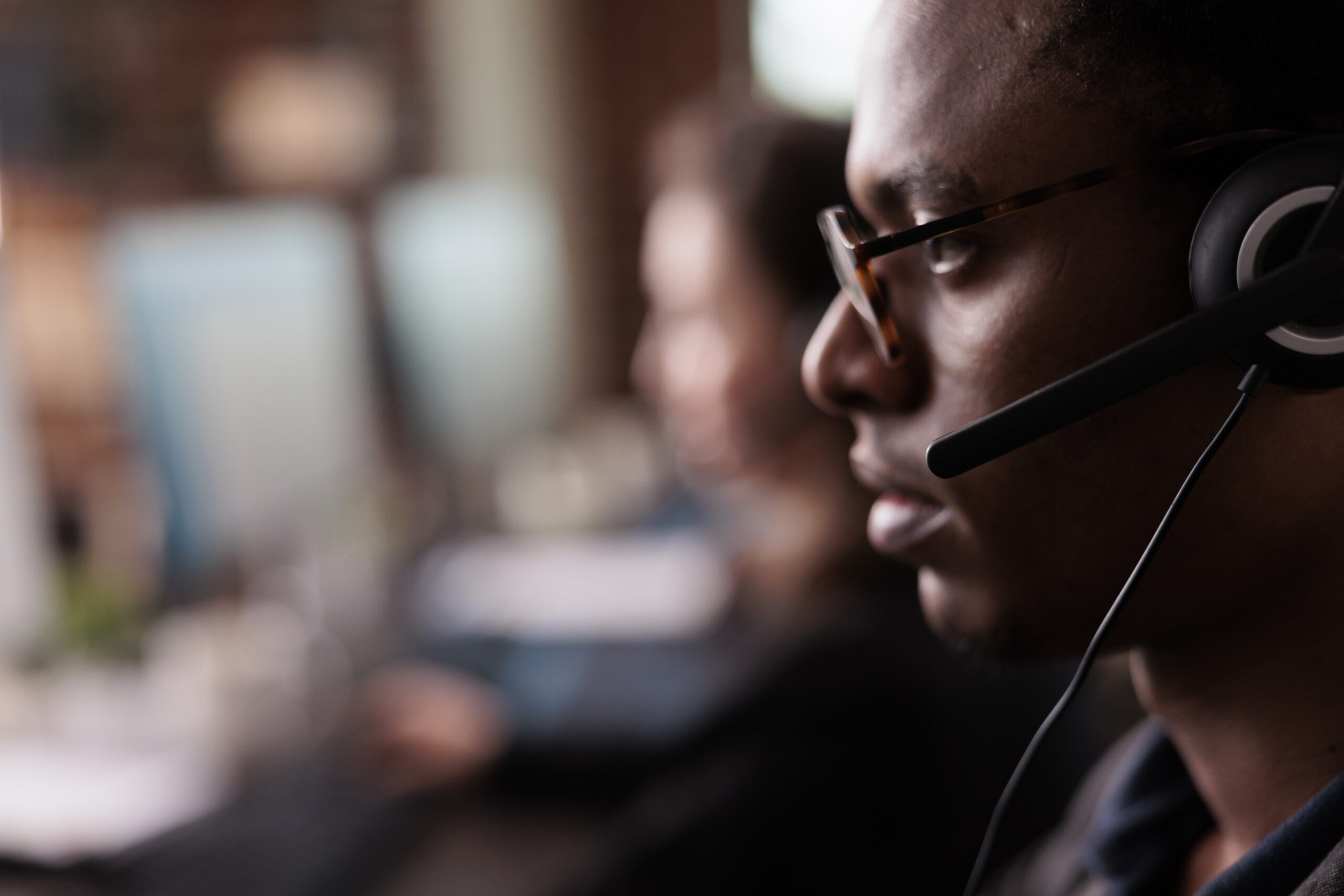 Helpdesk professional listening to a client call
