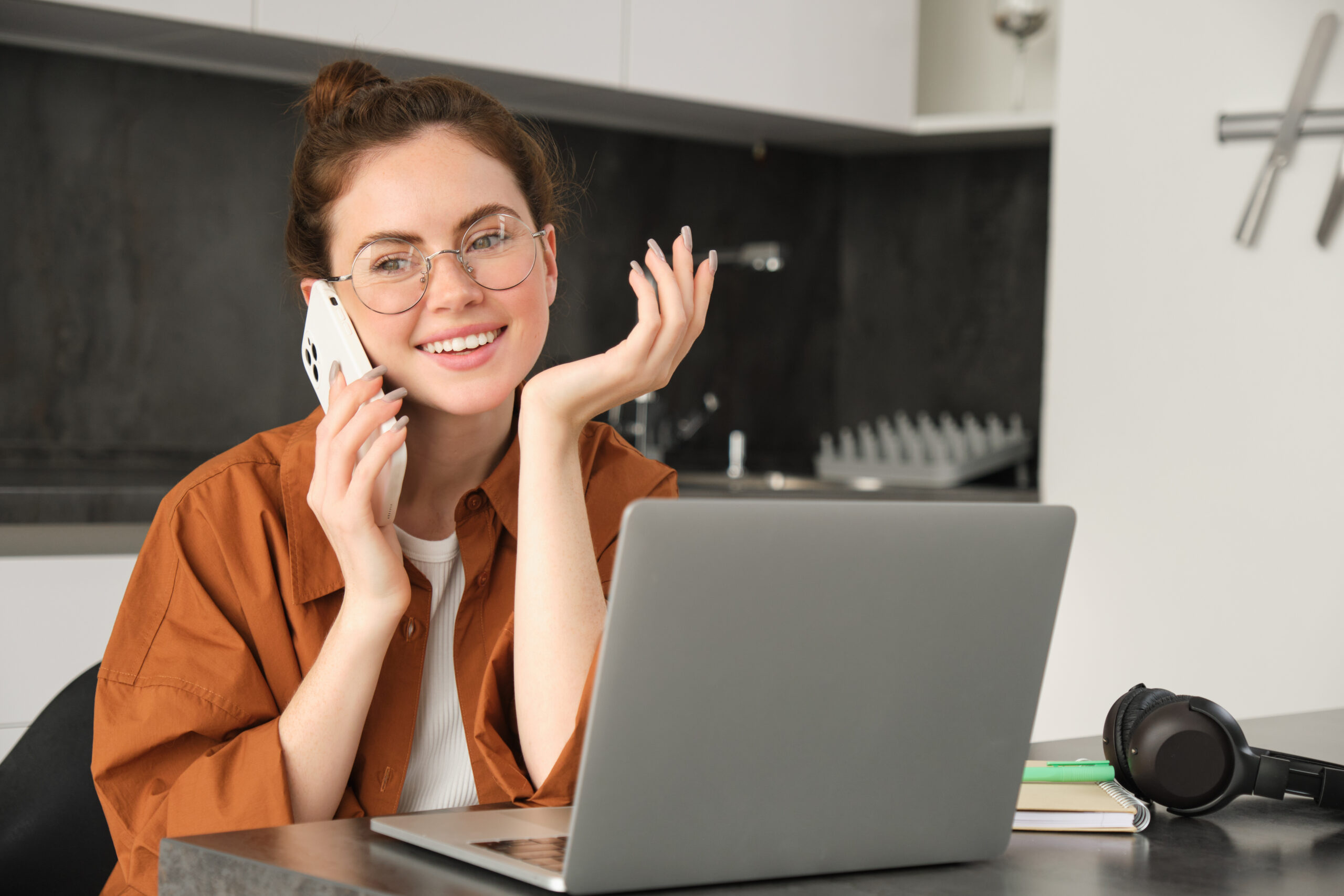 Professional woman working from home and calling a client